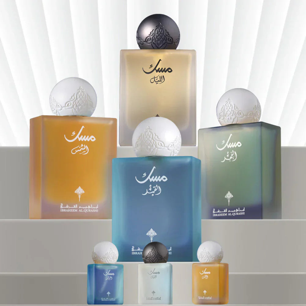 Elegant collection of Arabian oud perfume bottles in various colors with ornate round caps