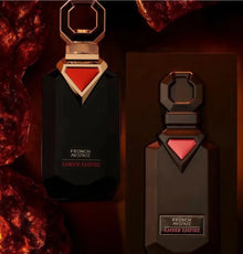 Luxury amber oud perfume bottle and box with gold and red accents, elegant dark setting