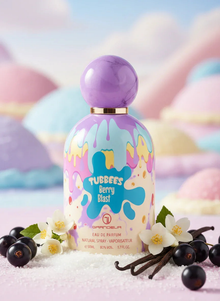 Colorful Tubbees Berry Blast perfume bottle with purple cap, surrounded by vanilla, berries, and flowers.