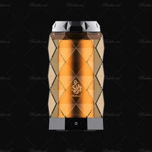 Luxurious gold Arabian oud air freshener with geometric design and Arabic script on black background