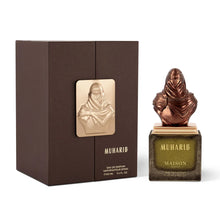 Muharib Arabian oud perfume bottle with sculpted bust cap and matching luxury gift box.