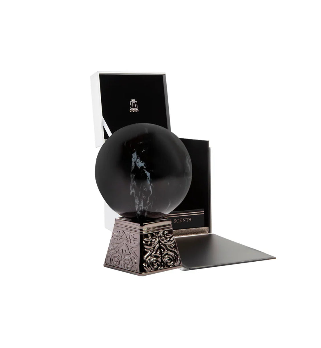 Decorative black sphere on a stand with a box in the background