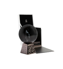 Luxury Arabian oud perfume bottle with ornate base and elegant gift box on white background
