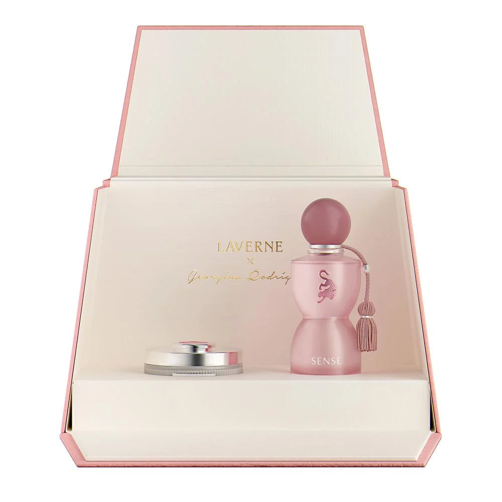 Pink perfume bottle with cap in a decorative box, featuring the brand 'Laverne'.