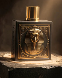 Luxurious Arabian oud perfume bottle with pharaoh design and gold accents on display