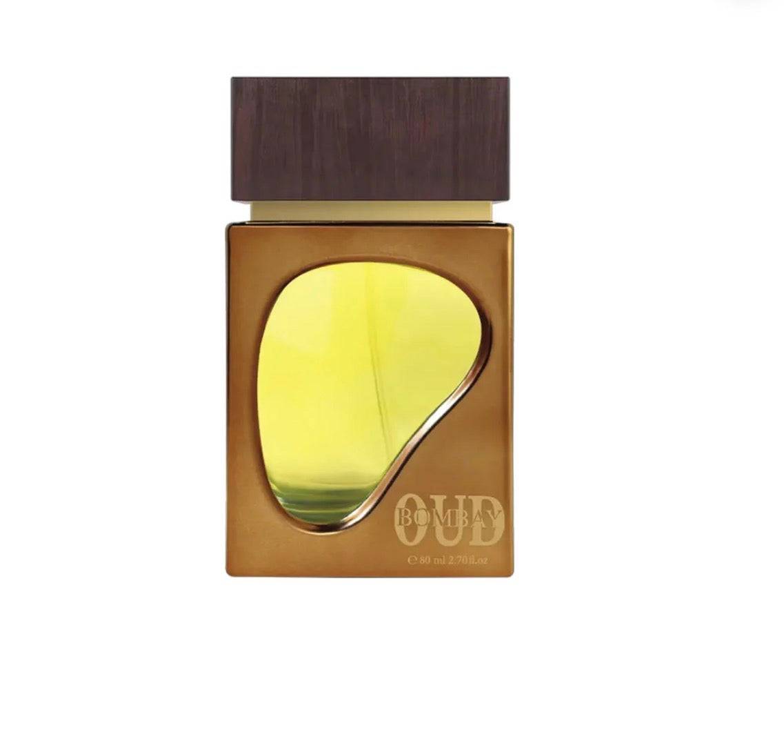 Perfume bottle with wooden cap and gold design on a white background