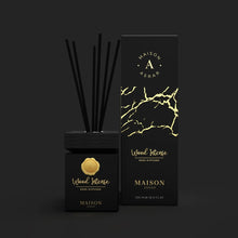Luxury black and gold Wood Intense reed diffuser with packaging, Arabian fragrance decor.