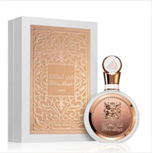 Luxury Arabian oud perfume bottle and ornate box with gold embossed design