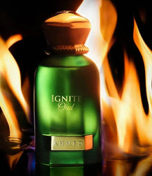 Green Ignite Oud perfume bottle with gold cap, surrounded by flames, luxury Arabian scent