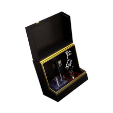 Elegant Deciduous Winter perfume in black box with gold accents for holiday gift