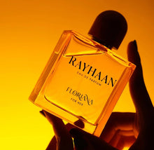 Rayhaan Floriana Eau de Parfum for her bottle held against a warm golden background