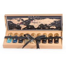 Luxury Arabian oud perfume gift set with assorted bottles in a box, world map background