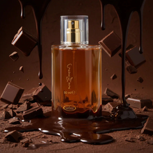 50ml Arabian oud perfume bottle surrounded by chocolate pieces and melted chocolate splash
