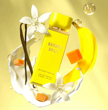 Banana Split perfume bottle with yellow banana, vanilla, caramel cubes, and white flowers on creamy splash