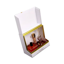 Decorative white box with gold tree design for Aurora Scents perfume set