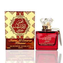 Shams Al Emarat Khususi Arabian oud perfume in a red bottle with crystal cap, next to ornate gold and red box, 100ml eau de parfum.