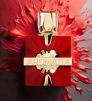 Red and gold Aromatix perfume bottle on a red and gray background