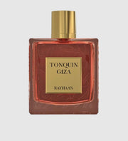 Perfume bottle labeled 'Tonquin Giza' by Rayhaan on a light gray background