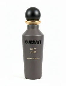 Surrati Gray Oud Extrait de Parfum bottle with black and gold cap on white background