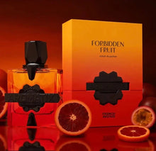 Aromatic Forbidden Fruit perfume bottle and box with fresh sliced blood oranges and passion fruit.