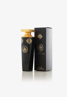 Elegant black and gold Arabian oud perfume bottle with matching luxury box.