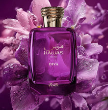 Purple Hawas For Her Diva perfume bottle with gold cap, surrounded by pink flowers and water droplets