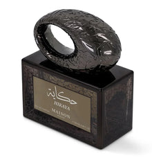 Maison Asrar Hikaya eau de parfum bottle with ornate dark cap and Arabic script, 100ml size