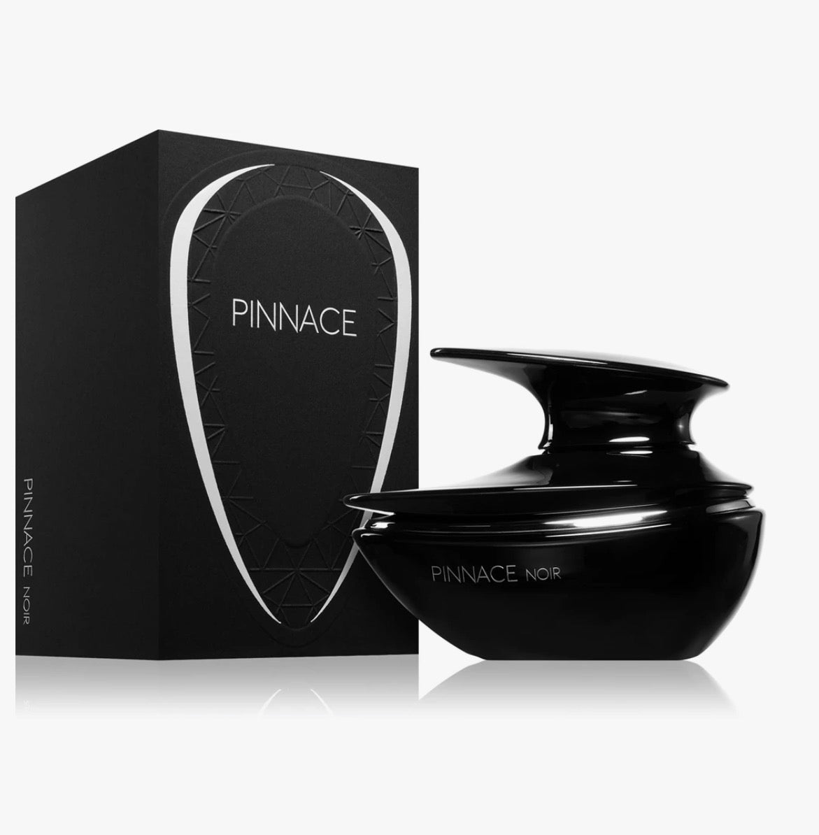 Black cosmetic jar and packaging with 'Pinnacle' branding on a white background