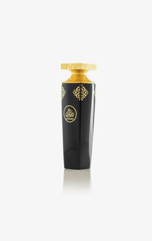 Luxurious Arabian oud perfume bottle with black and gold ornate design, Madawi label