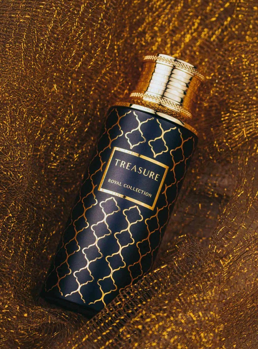 Perfume bottle labeled 'Treasure Royal Collection' on a textured brown background