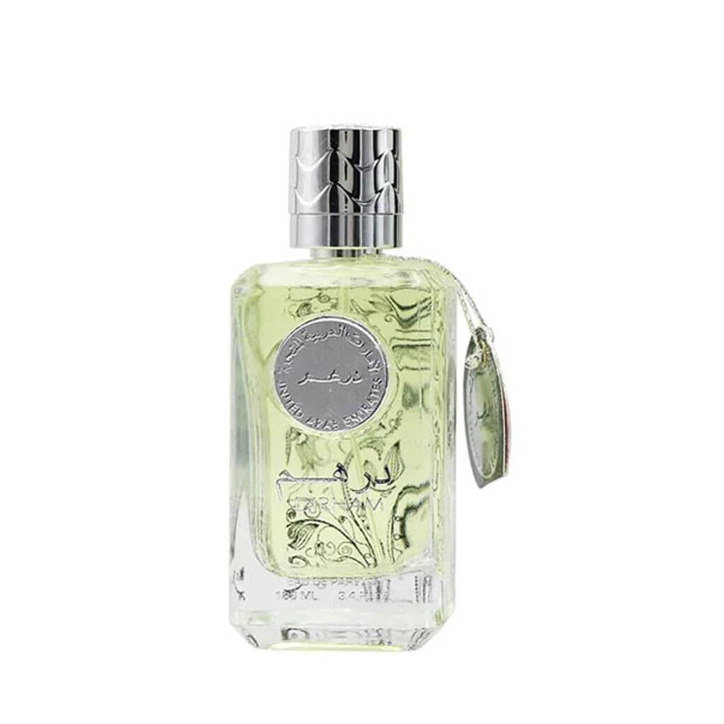 Clear glass bottle of Arabian oud perfume with silver cap and decorative tag