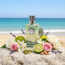 Arabian oud perfume bottle on beach with lime, roses, cardamom, cinnamon, and flowers