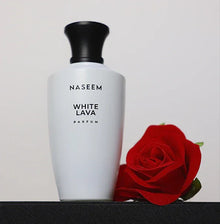 Naseem White Lava Arabian perfume bottle with a red rose on a black surface