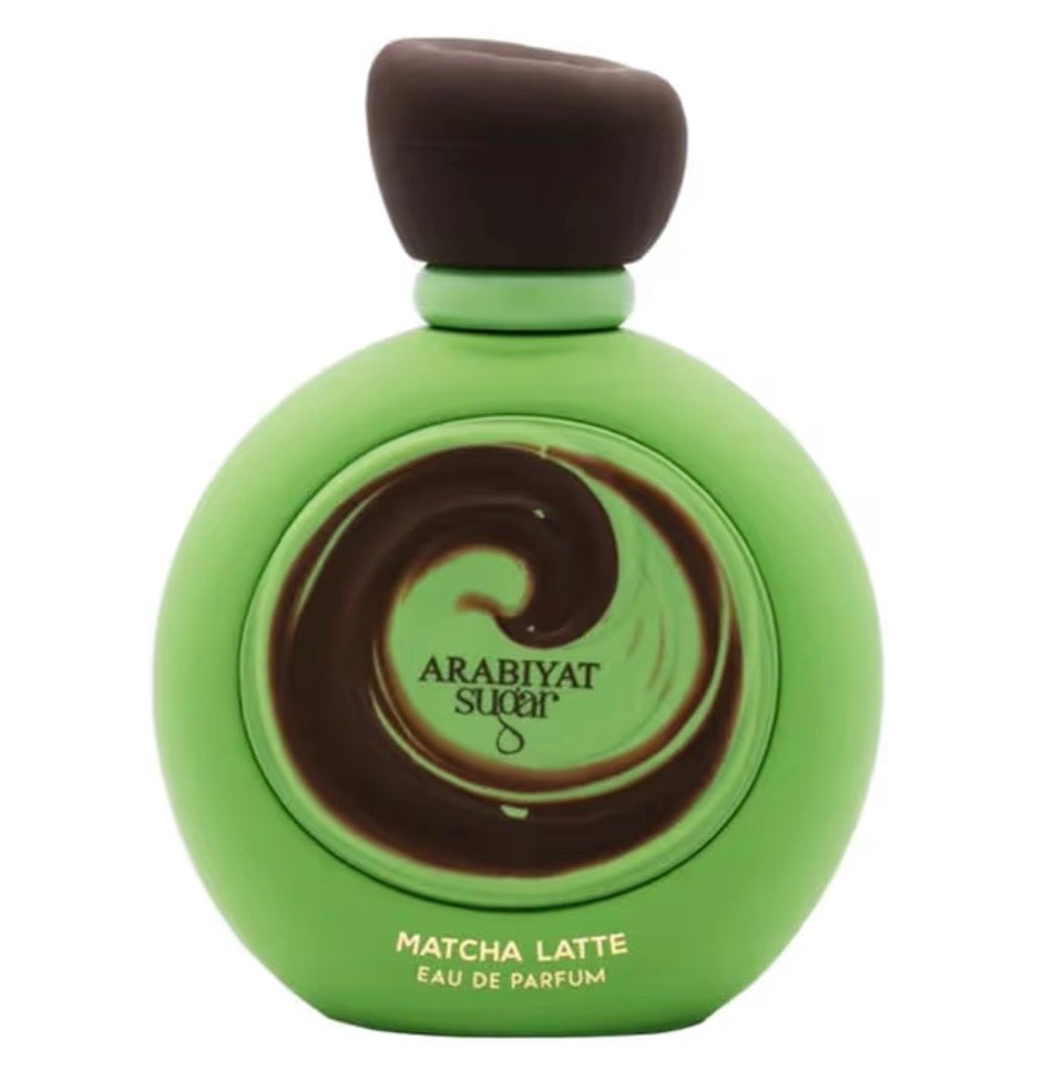 Green perfume bottle with brown cap labeled 'Arabiyat Sugar Matcha Latte' on a white background