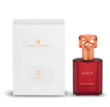 Swiss Arabian Rose 01 oud perfume bottle with decorative rose gold cap beside elegant white box