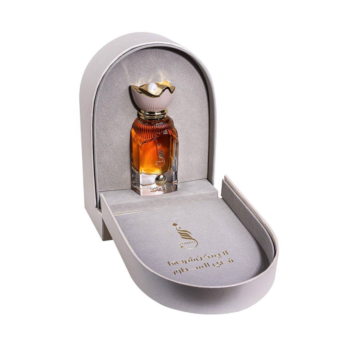 Perfume in elegant white box with gold accents