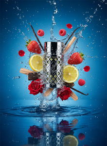 Luxury Arabian oud perfume bottle splashing in water with lemon, strawberry, vanilla, rose, and raspberry.