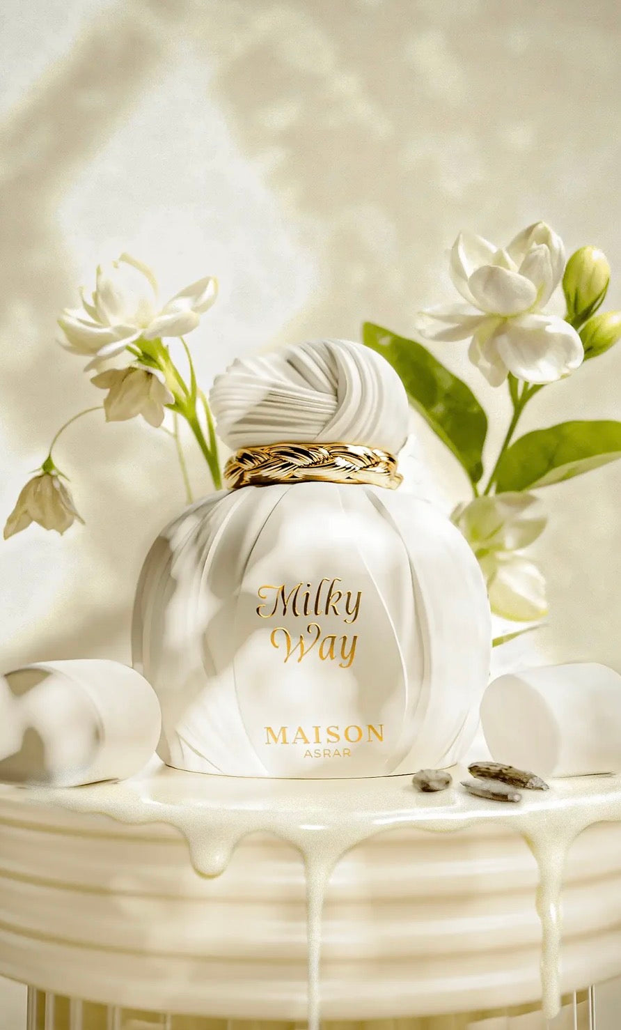 Maison Parfum bottle labeled 'Milky Way' with flowers on a decorative table.