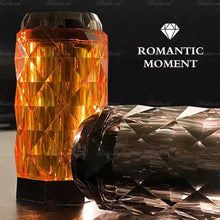 Diamond-cut oud perfume bottles, one upright and one lying down, with 'Romantic Moment' text.