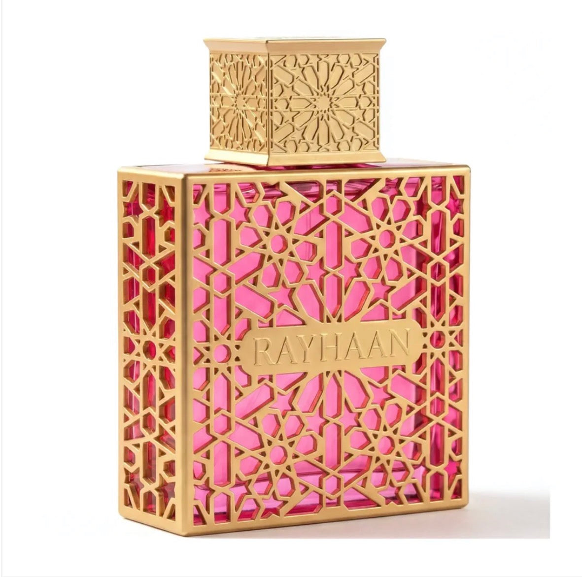 Perfume bottle with intricate gold and pink design on a white background