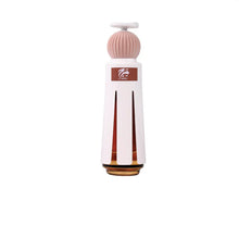 Elegant Arabian oud perfume bottle with white and pink ribbed design on white background