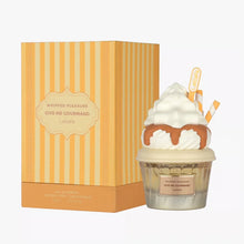 Whipped Pleasure Give Me Gourmand perfume with cupcake-inspired bottle and orange striped box.