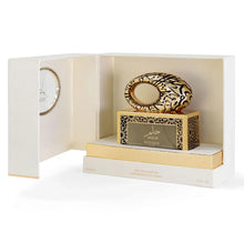 Luxury Arabian oud perfume bottle with ornate gold design in an elegant presentation box