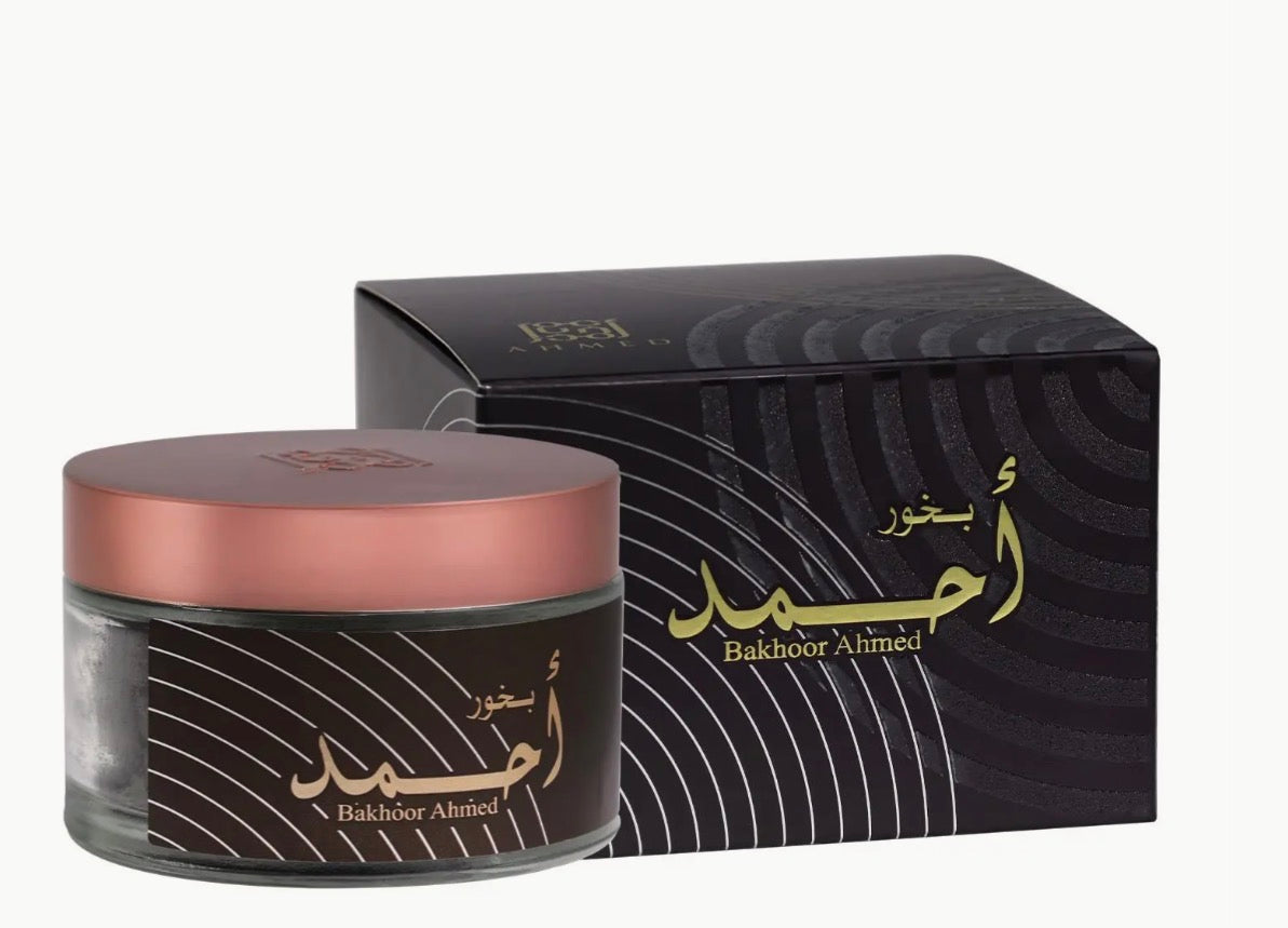 Bakhoor Ahmad woody incense jar with pink lid and black packaging