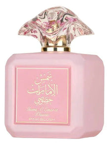 Pink bottle of Arabian oud perfume with floral-patterned cap and gold script label.