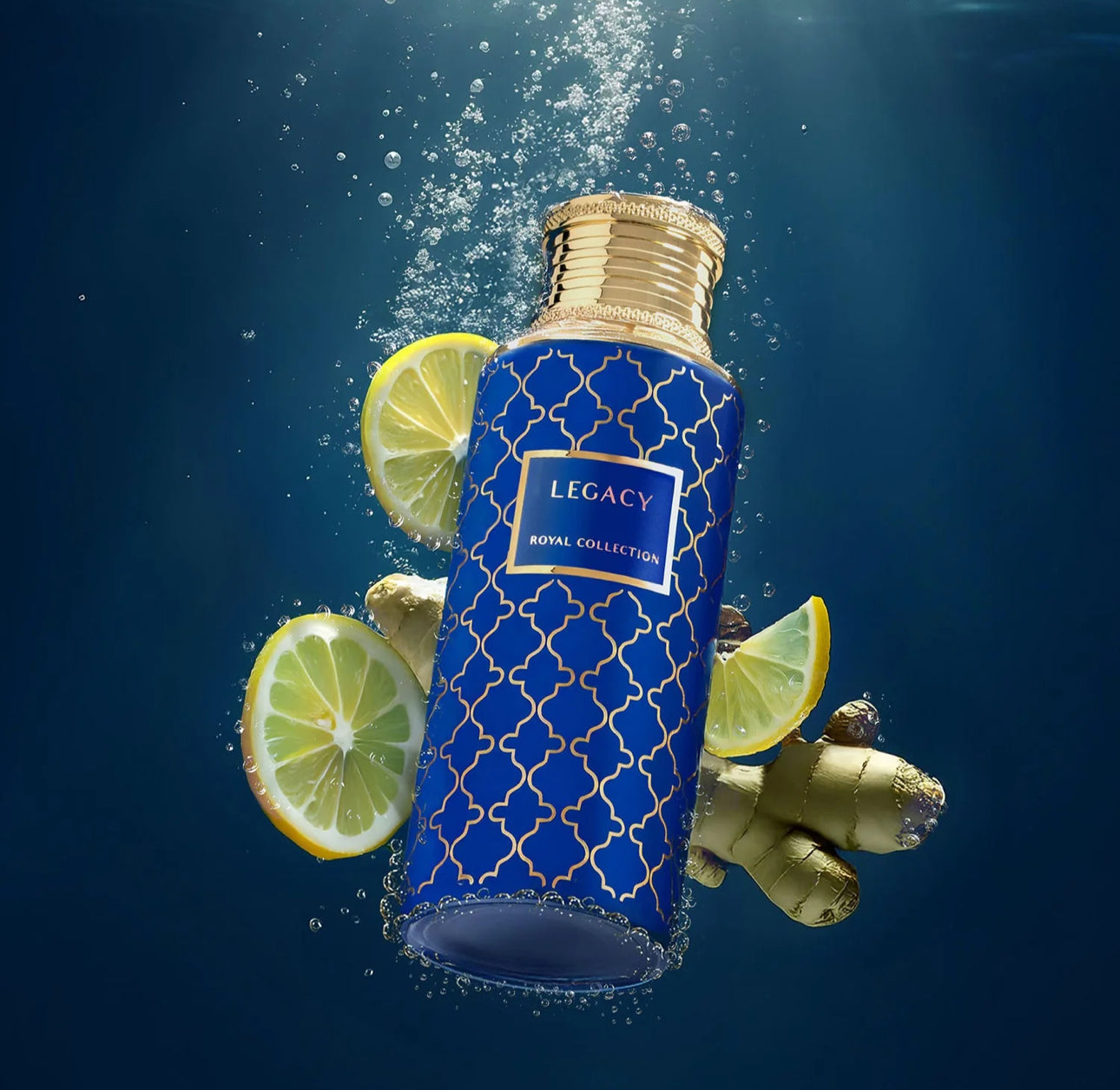 Legacy Royal Collection oud perfume bottle underwater with lemon slices and ginger