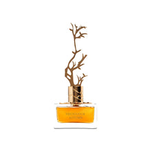 Close-up of Deciduous Autumn perfume bottle with branch design