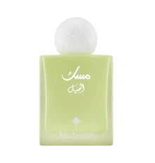 Green Arabian oud perfume bottle with Arabic script and frosted round cap