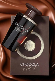 Chocolate-themed perfume bottle labeled 'Chocola Addict' on matching brown gift box, luxury scent product.