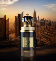 Arabiyat Prestige Arabian oud perfume bottle with decorative cap, city skyline at sunset